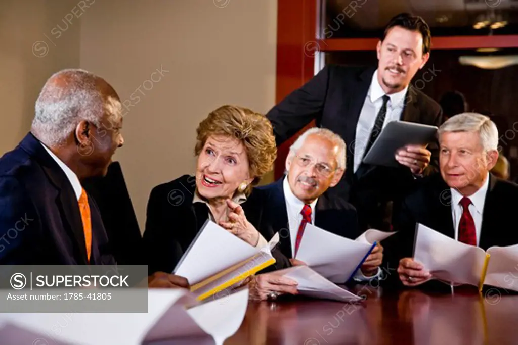 Manager presenting to senior executives in boardroom