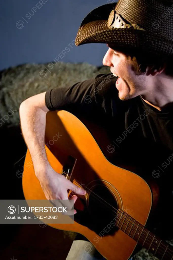Singing cowboy and playing guitar
