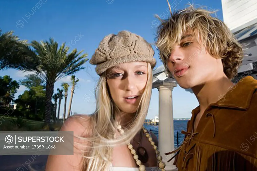 Portrait of a young couple in vintage 1960's hippie costumes