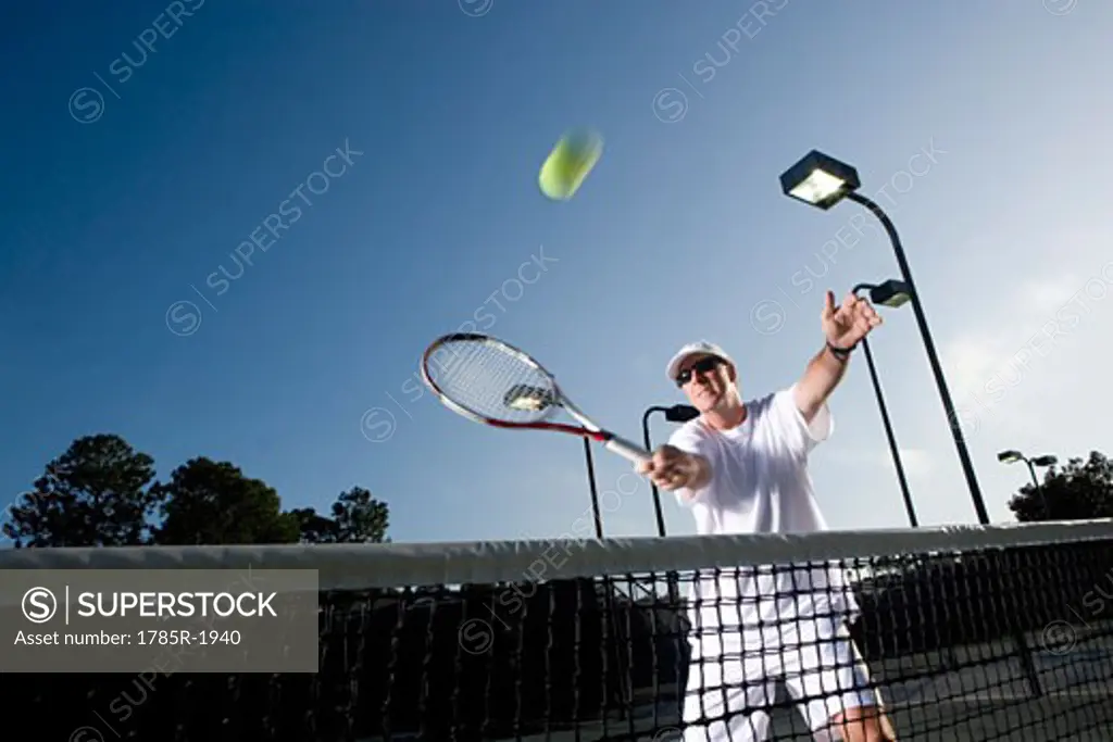 Tennis player hitting a volley