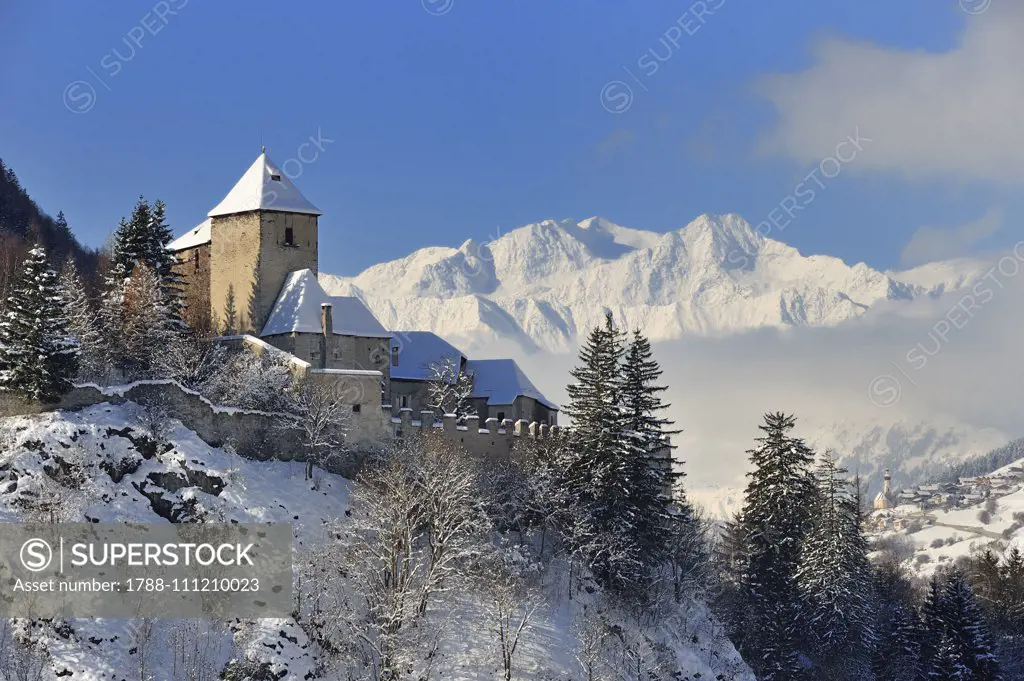 Winter view of Castel Tasso with the peaks of the Ridanna Valley in the background, Campo di Trens, Trentino-Alto Adige, Italy.