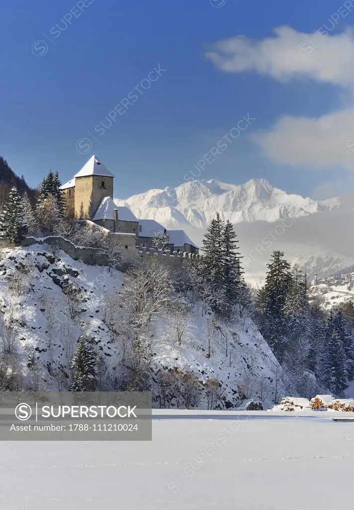 Winter view of Castel Tasso with the peaks of the Ridanna Valley in the background, Campo di Trens, Trentino-Alto Adige, Italy.