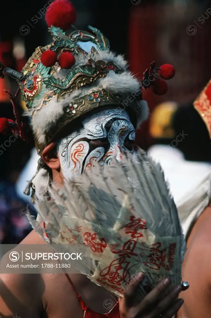 Taiwan, Chiayi County, Pei-Kang, masked performer at Taoist ceremony near Matsu Temple