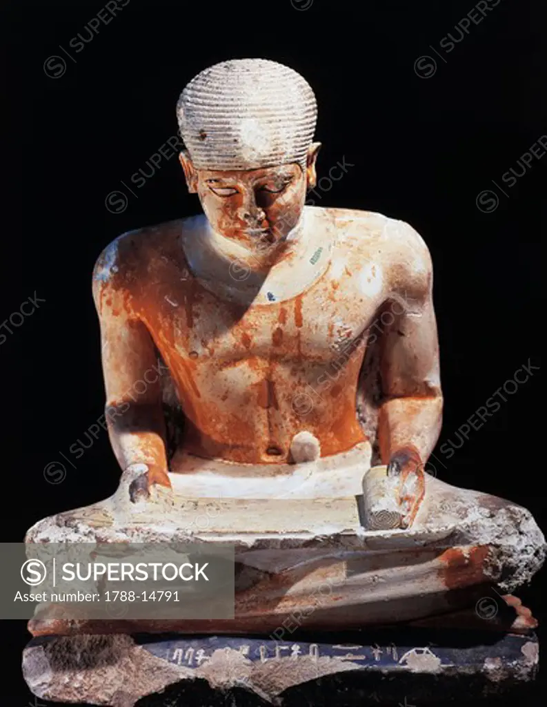 Painted limestone statuette of scribe seated, from Giza, Egypt
