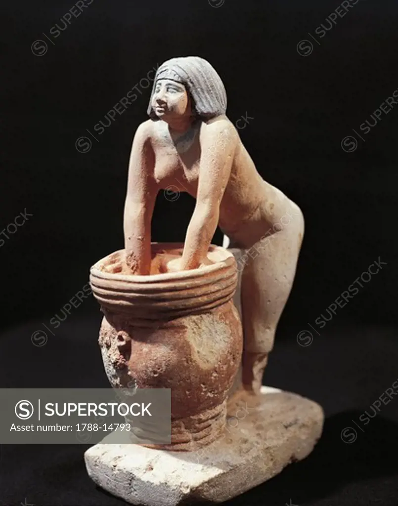 Painted limestone statuette of woman making beer, from Giza, Egypt