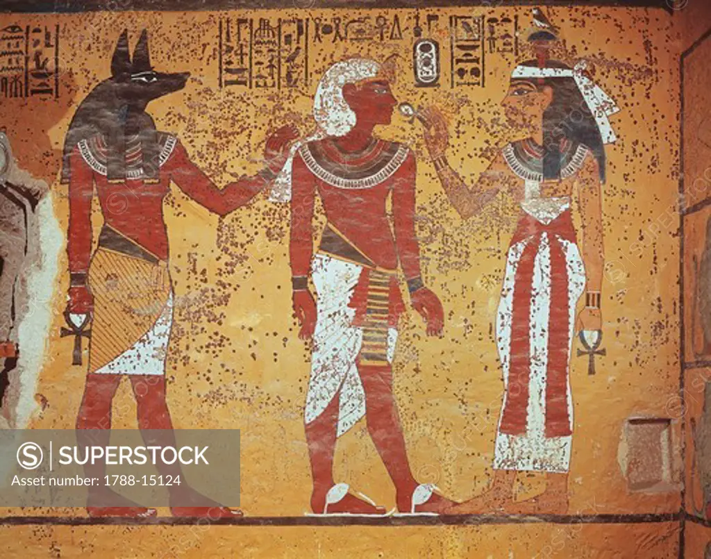 Egypt, Thebes, Luxor, Valley of the Kings, Tomb of Tutankhamen, burial chamber, detail of mural paintings. In the presence of Anubis, pharaoh receives symbol of eternal life 'ankh' from sky goddess Hathor