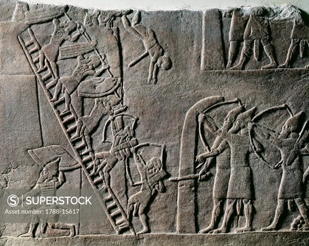 Detail of relief showing soldiers using ladders to scale walls and capture Ethiopians from Egyptian city, from ancient Nineveh, Iraq