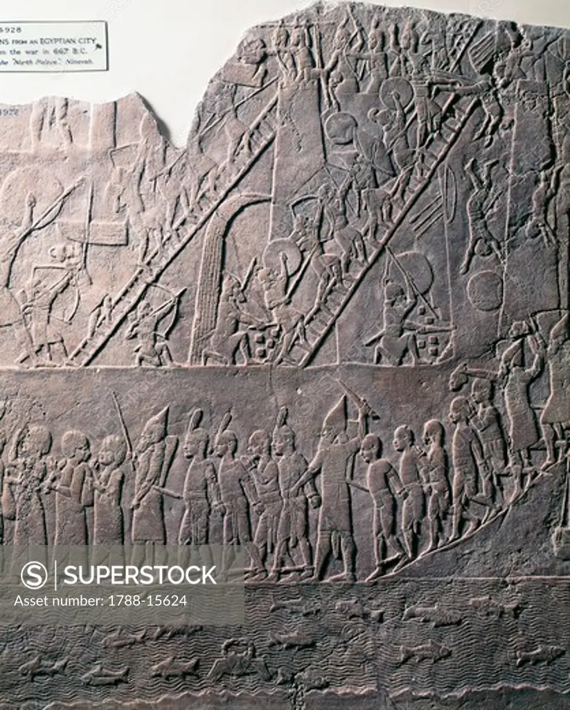 Detail of relief showing soldiers using ladders to scale walls and capture Ethiopians from Egyptian city, from ancient Nineveh, Iraq