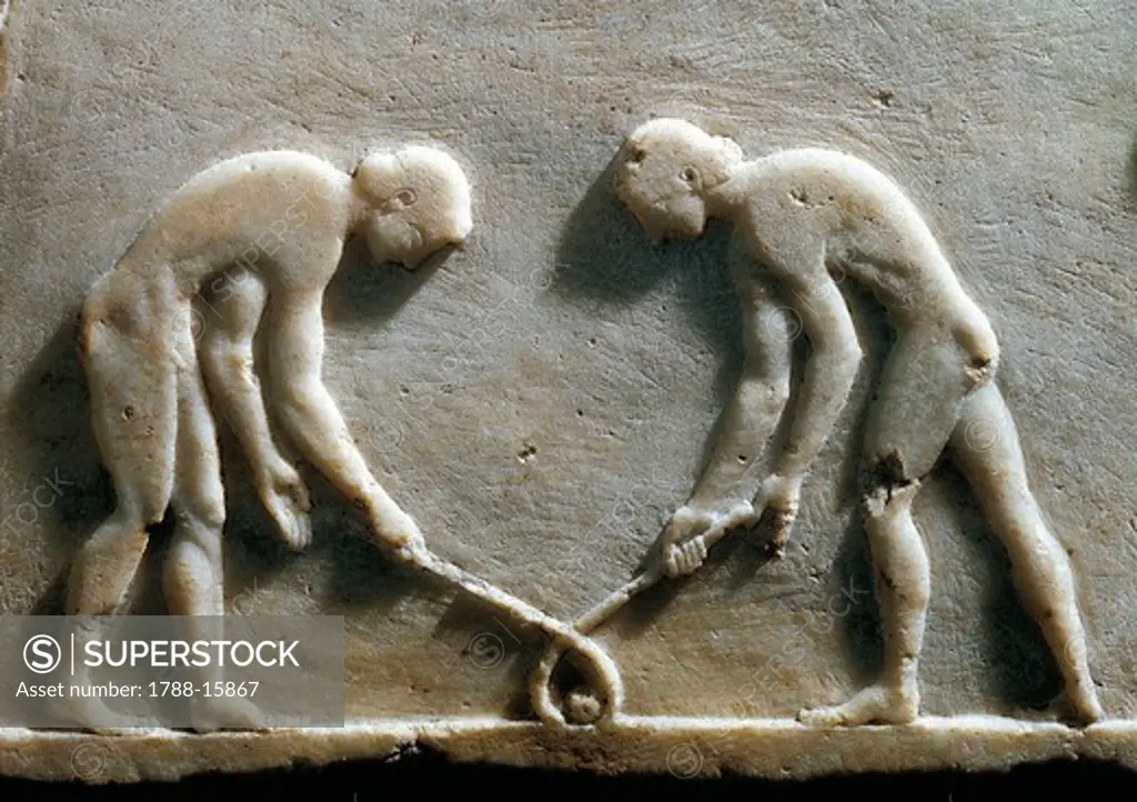 Greek civilization, Plinth of kouros statue, bas-relief depicting players with sticks and ball, known as ""Hockey players"", close-up, circa 490 B.C. from Kerameikos necropolis in Athens, Greece