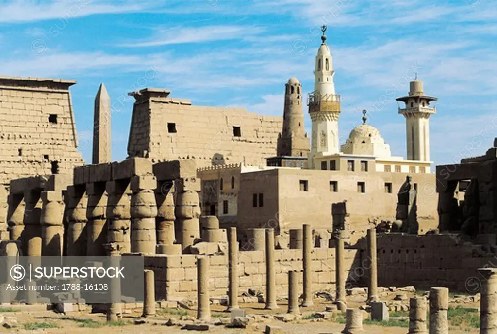 Egypt, Ancient Thebes Luxor, Temple of Amon, Ruins and pylon of Ramses II in background