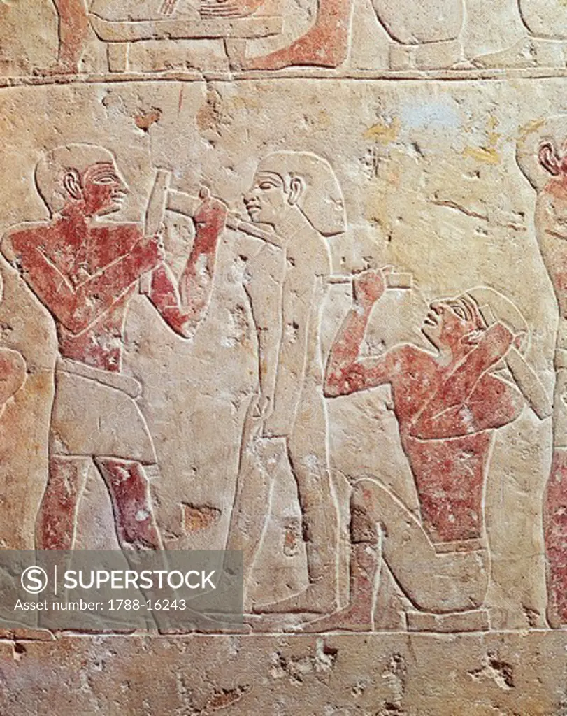 Relief depicting sculptors working at statue, from Saqqara, Egypt
