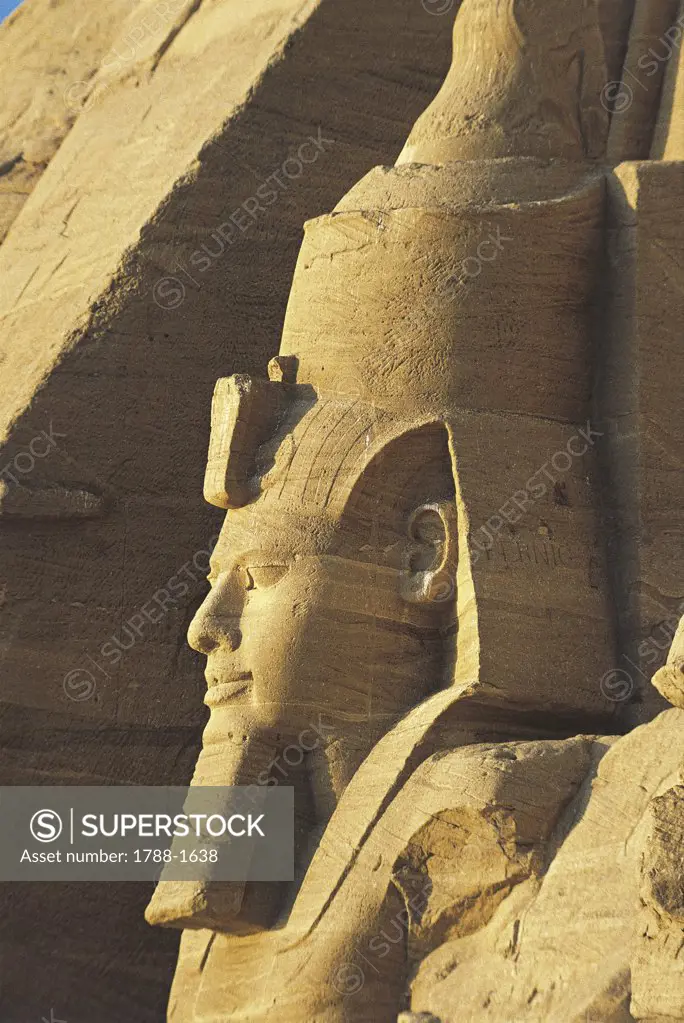 Egypt. Nubian monuments at Abu Simbel (UNESCO World Heritage List, 1979). Great Temple of Ramses II. Detail of Ramses II statue