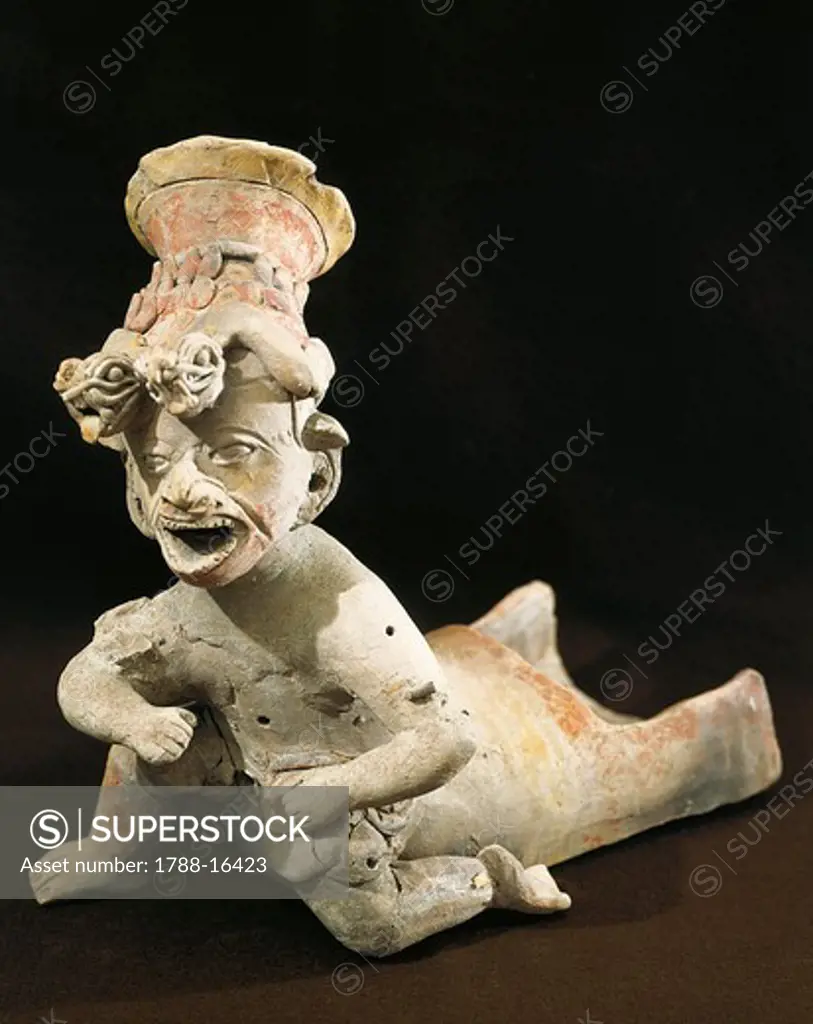 Polychrome terracotta statue depicting dancing priest wearing headdress from Bahia de Caraquez, 5th century B.C.-5th century A.D.