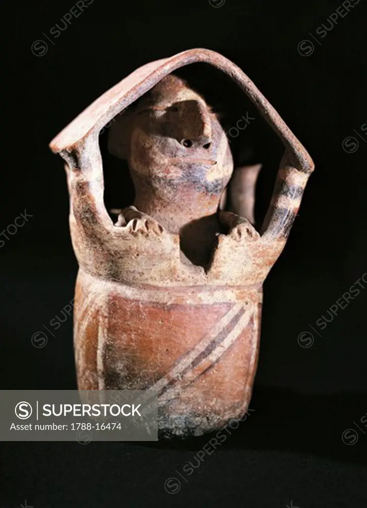 Polychrome terracotta vessel in shape of a house with a man inside, Peru, Vicus culture, circa 100 B.C.