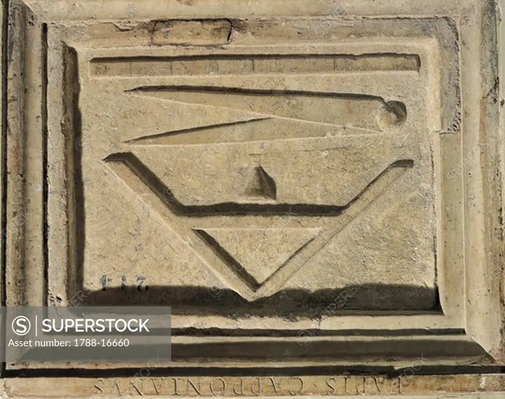 Tombstone depicting work tools of architect