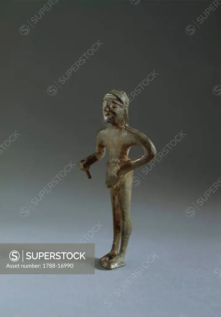 Etruscan bronze figure of offering man, 7th Century B.C.