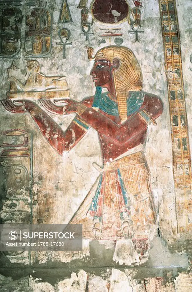 Egypt, Luxor, Karnak Temple complex, Temple of Khonsu, painted relief of pharaoh