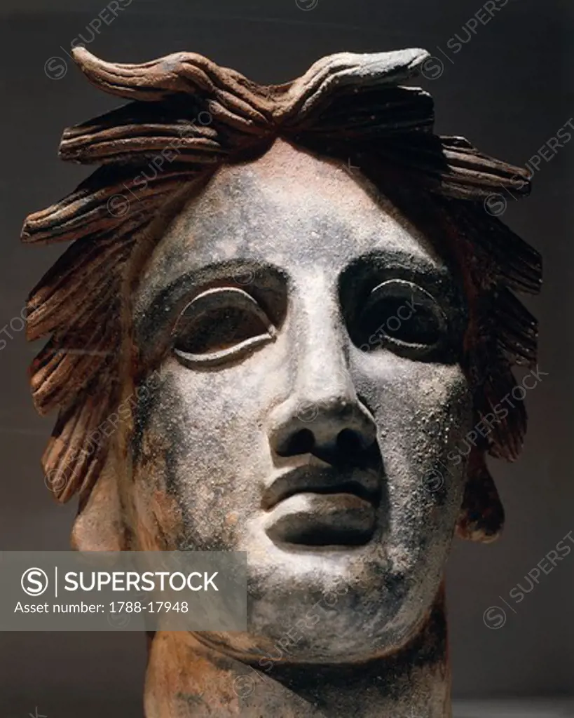 Terracotta female head, from Cagliari, Sardinia region, Italy