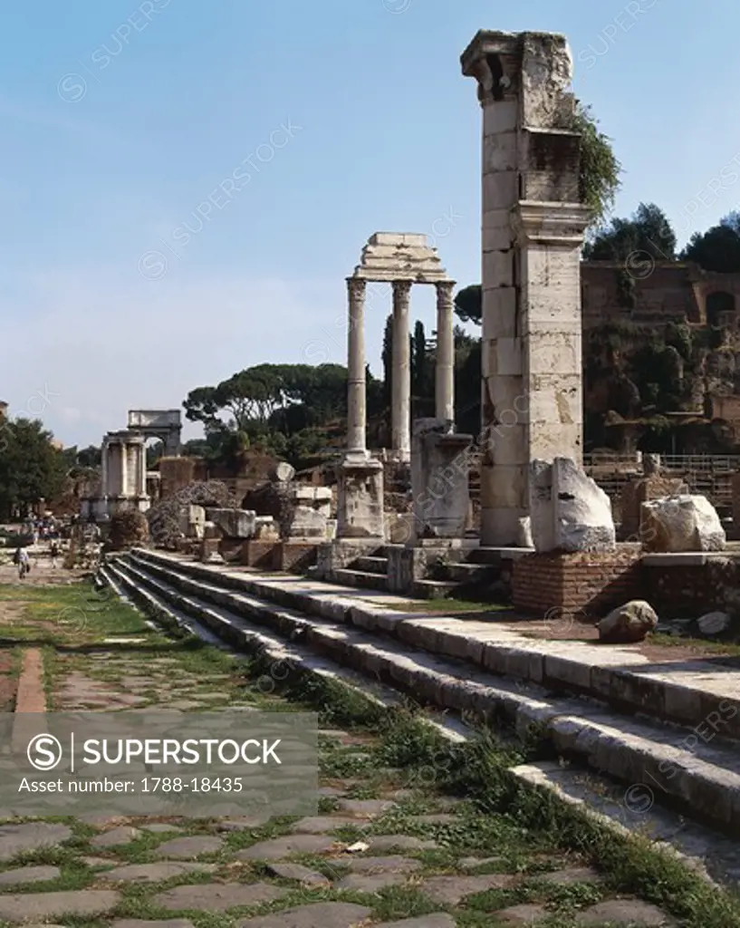 Italy, Latium region, Rome, Imperial Fora, three Corinthian columns of Temple of Castor and Pollux and steps of Basilica Julia
