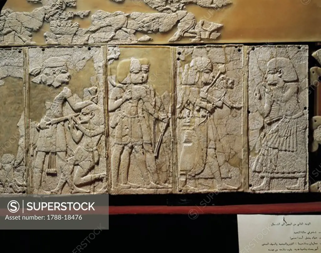 Ivory panel depicting prince praying, man with lion cub and war scenes, from Ugarit, Ras-Shamra, Syria