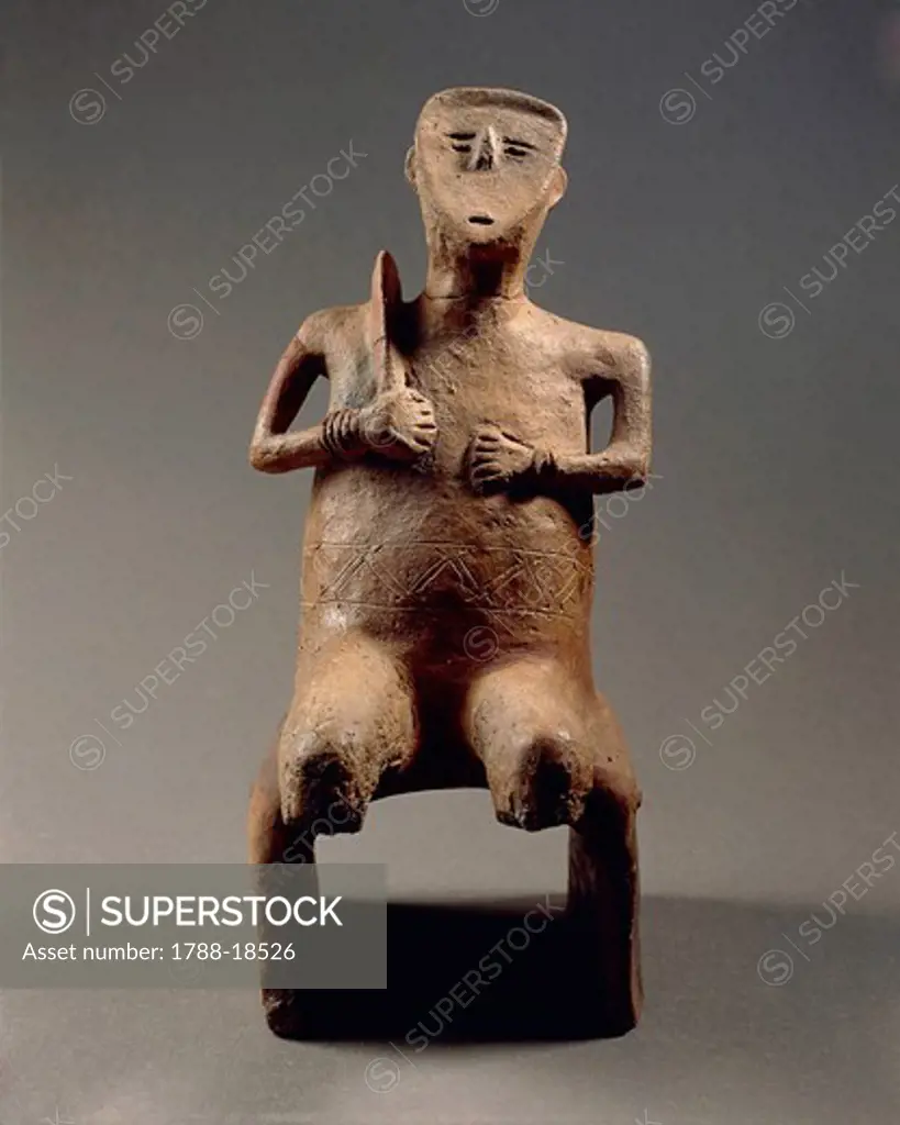 Terracotta statuette of idol with sickle, from Szegvar-Tuzkoves