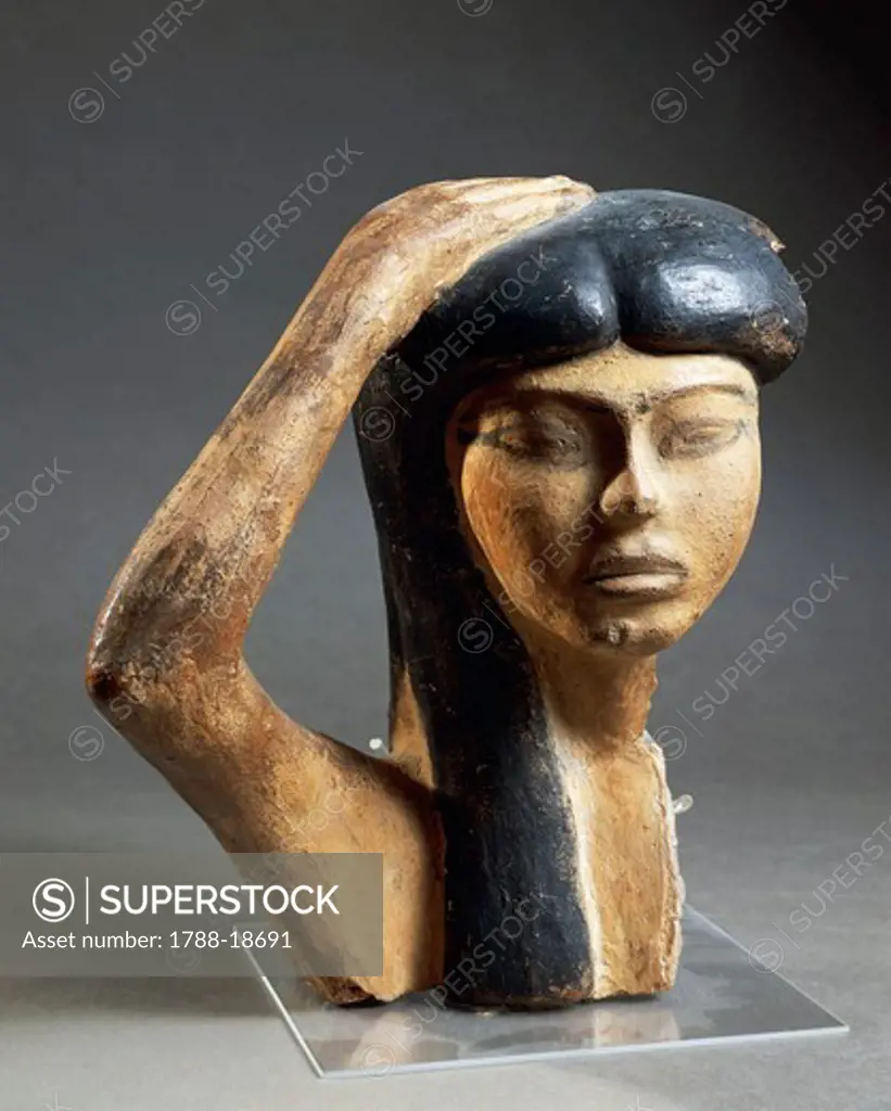 Painted terracotta head of woman mourner or Isis mourning Osiris