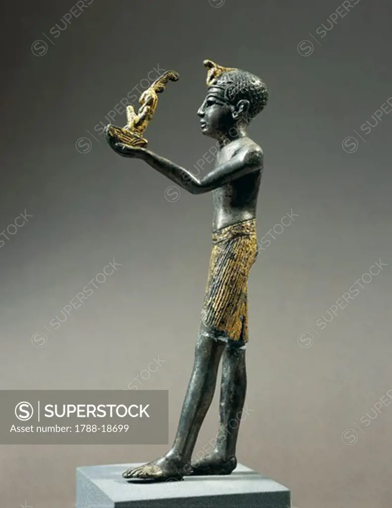 Gold-plated silver statuette of Ramesside king offering Maat, goddess of truth and order of world
