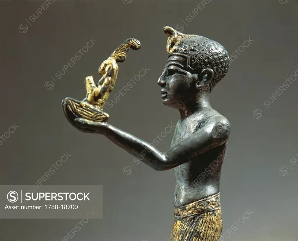 Gold-plated silver statuette of a Ramesside king offering Maat, goddess of truth and order of the world