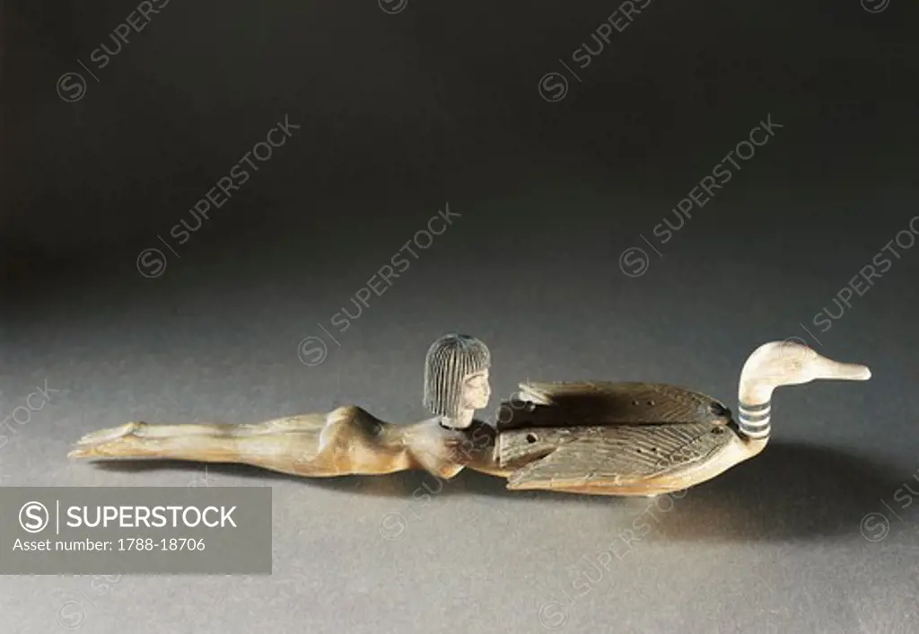 Wood and ivory cosmetic spoon in the shape of a female swimmer holding a duck