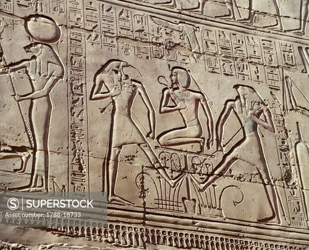 Interior wall reliefs depicting offerings to the deities, detail showing young Ramses II with deities Thoth and Horus