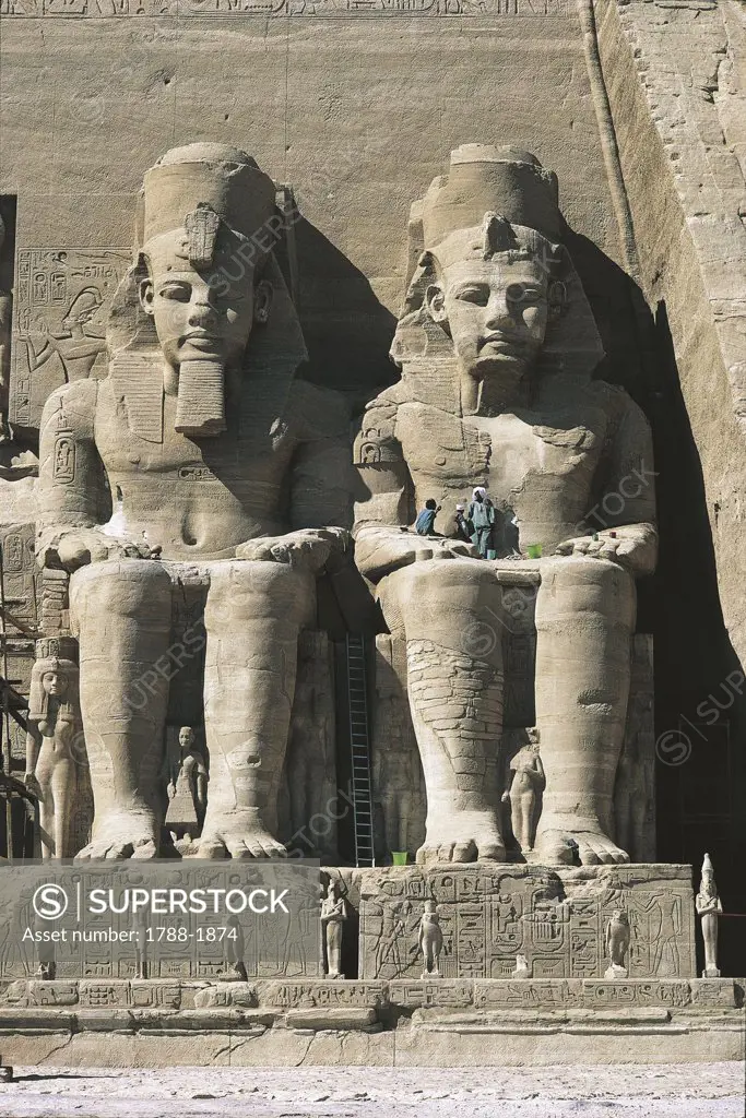 Egypt. Nubian monuments at Abu Simbel (UNESCO World Heritage List, 1979). Great Temple. Colossal sandstone figures of enthroned Ramses II