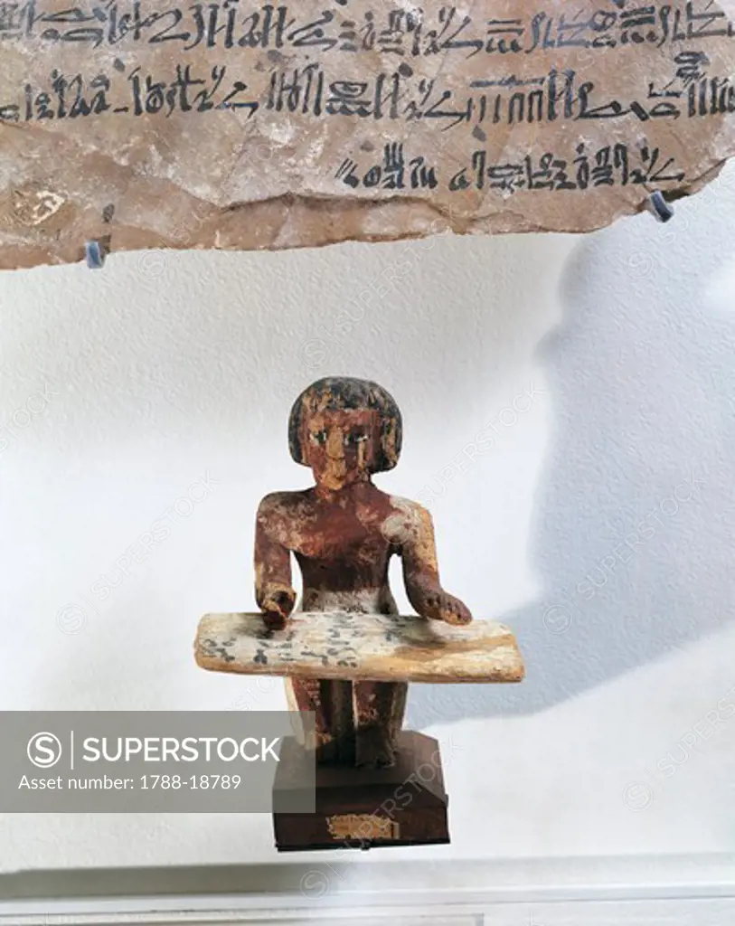 Painted wood statue of scribe Intef recording wheat harvest, on top, fragment of letter, written in hieratic, from Vizier Djehutymes to Imenhetep, circa 1120 B.C.