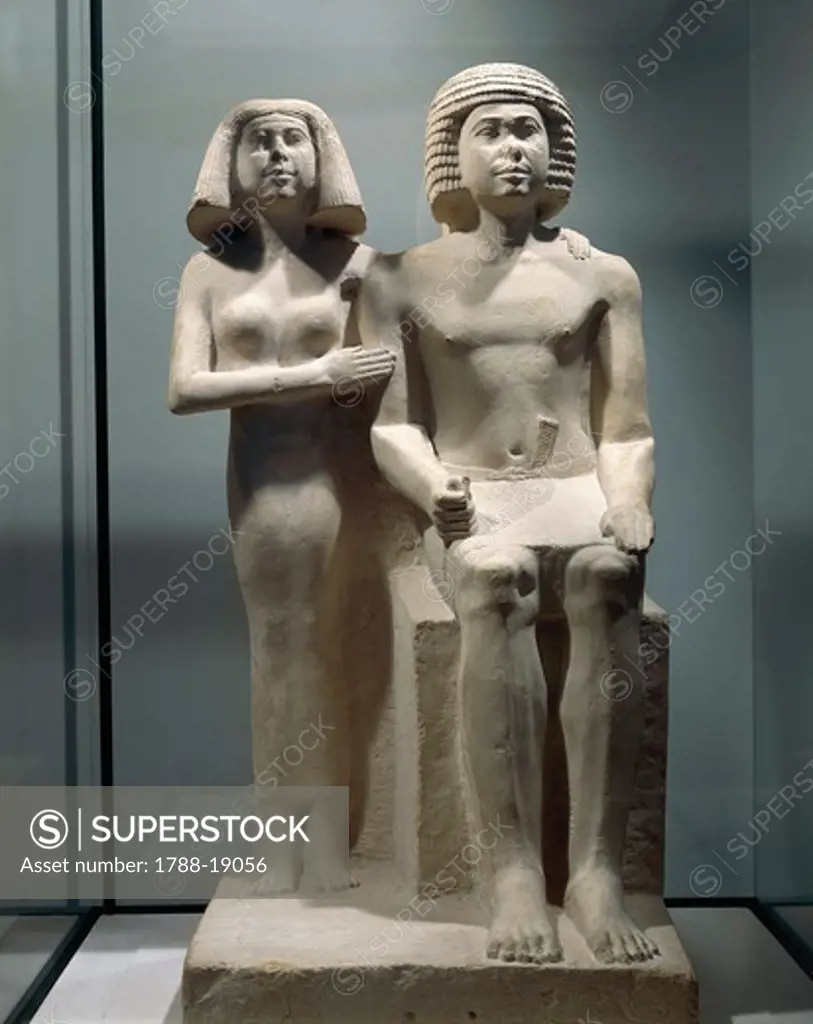 Limestone sculptural group depicting a married couple