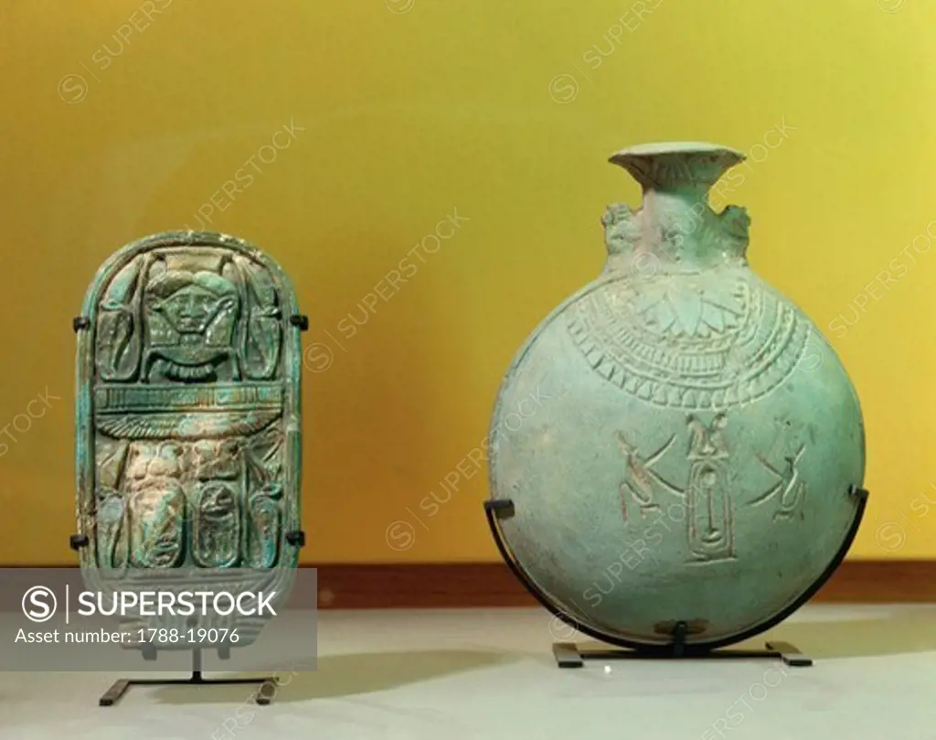 Little flask of Psamtik II made of siliceous majolica and box lid of Nitocris