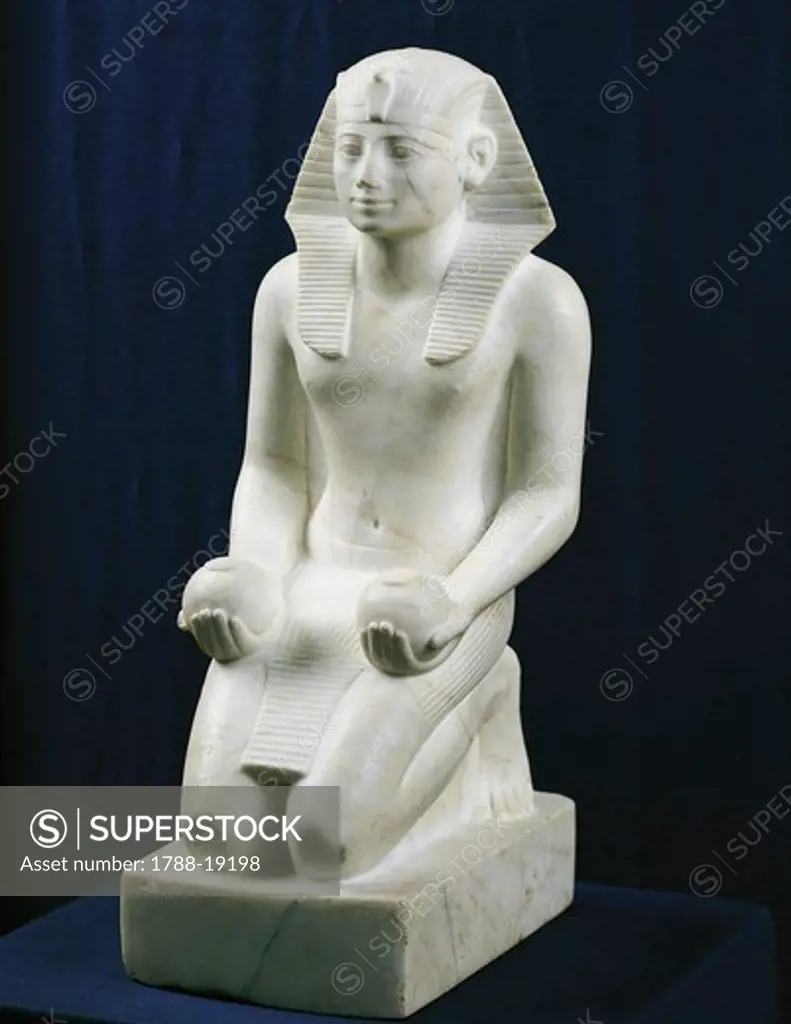 Kneeling statue of Tuthmosis III in an offering position from Karnak