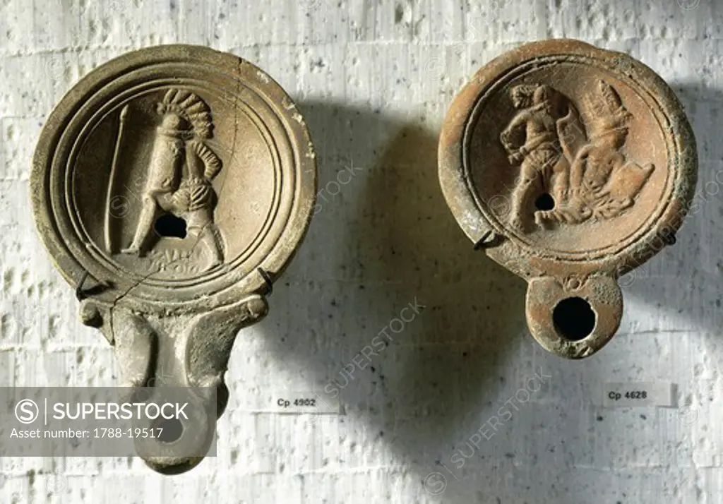 Terracotta oil lamps decorated with reliefs: gladiator (Valeri Hroci) training and gladiatorial combat