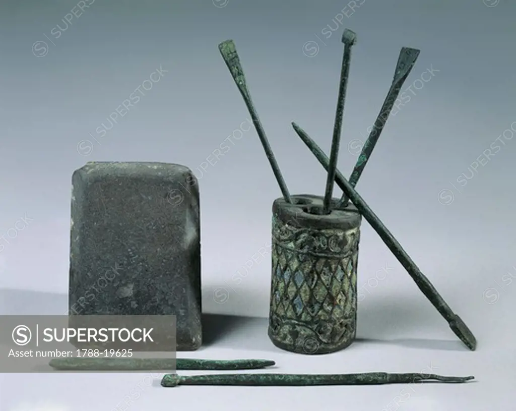Writing material and instruments, schist tablet, inkwell and bronze styli, From Volubilis (Morocco)
