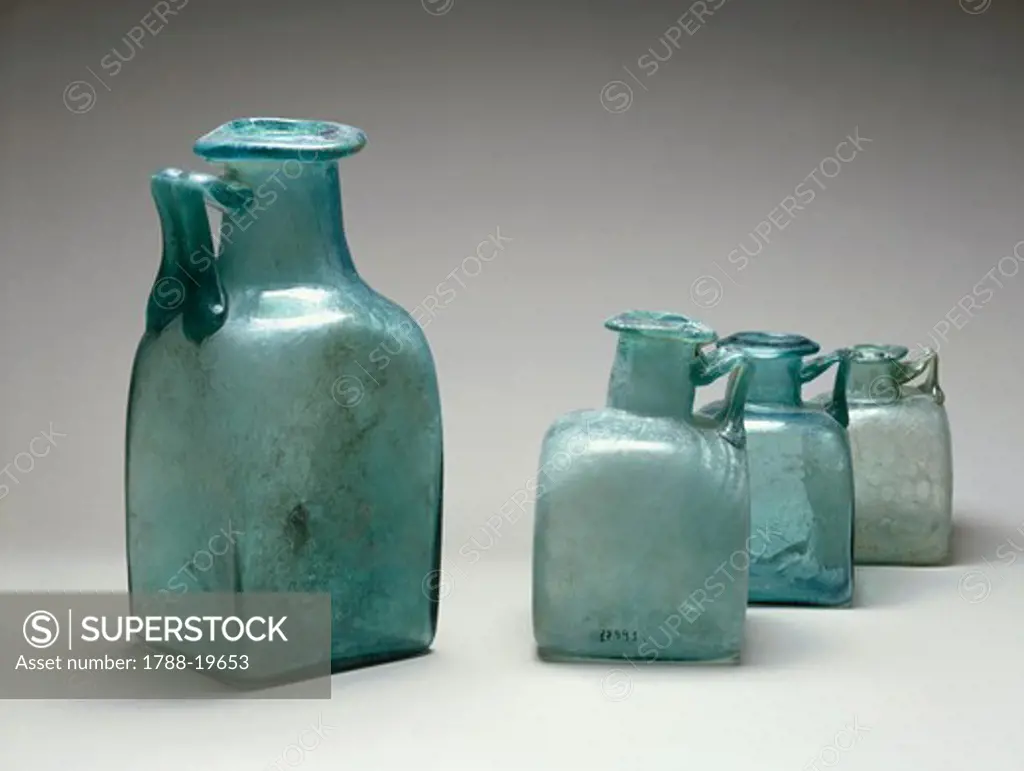 Four blue glass bottles, used as measures of capacity, from Pompei