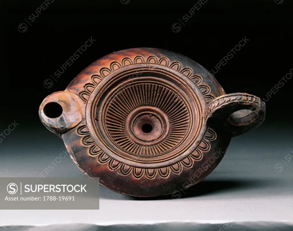 Decorated clay oil lamp, from Pompei