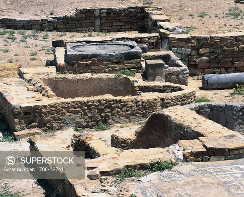 Tunisia, Thuburbo Majus, ruins of olive press at Roman archaeological site