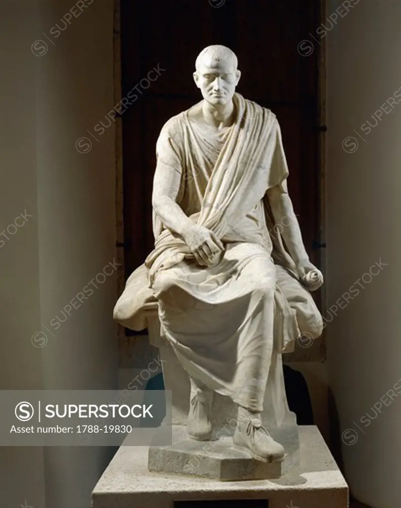 Marble statue of seated togaed man