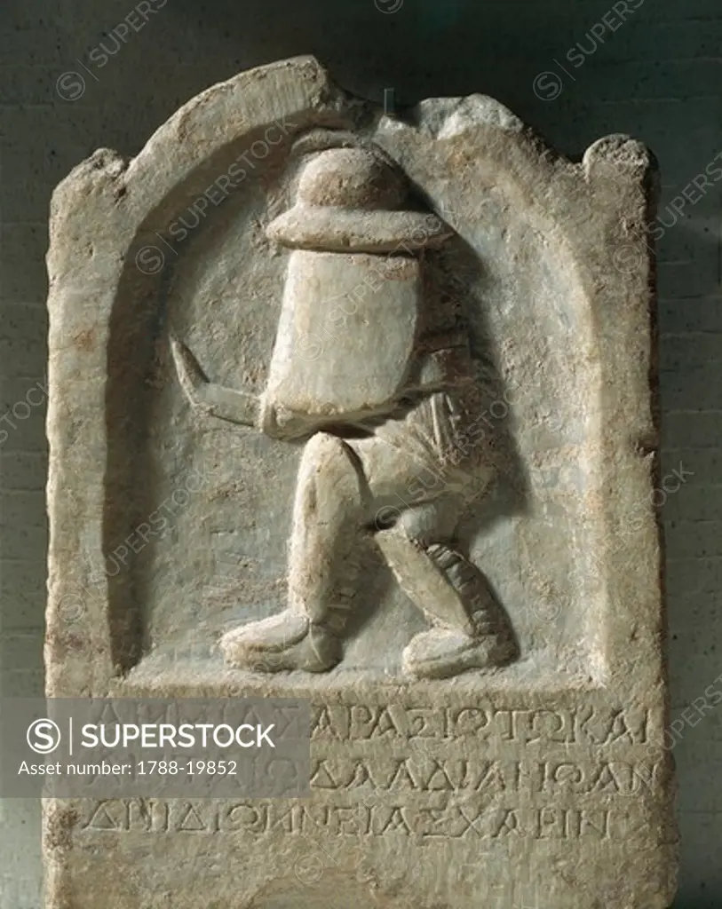 Funerary stone of gladiator of Thracian origin, Relief of gladiator with armor and engraving of Ammias of Araxios, in memory of her husband, From Thyateira, Akhisar, Turkey