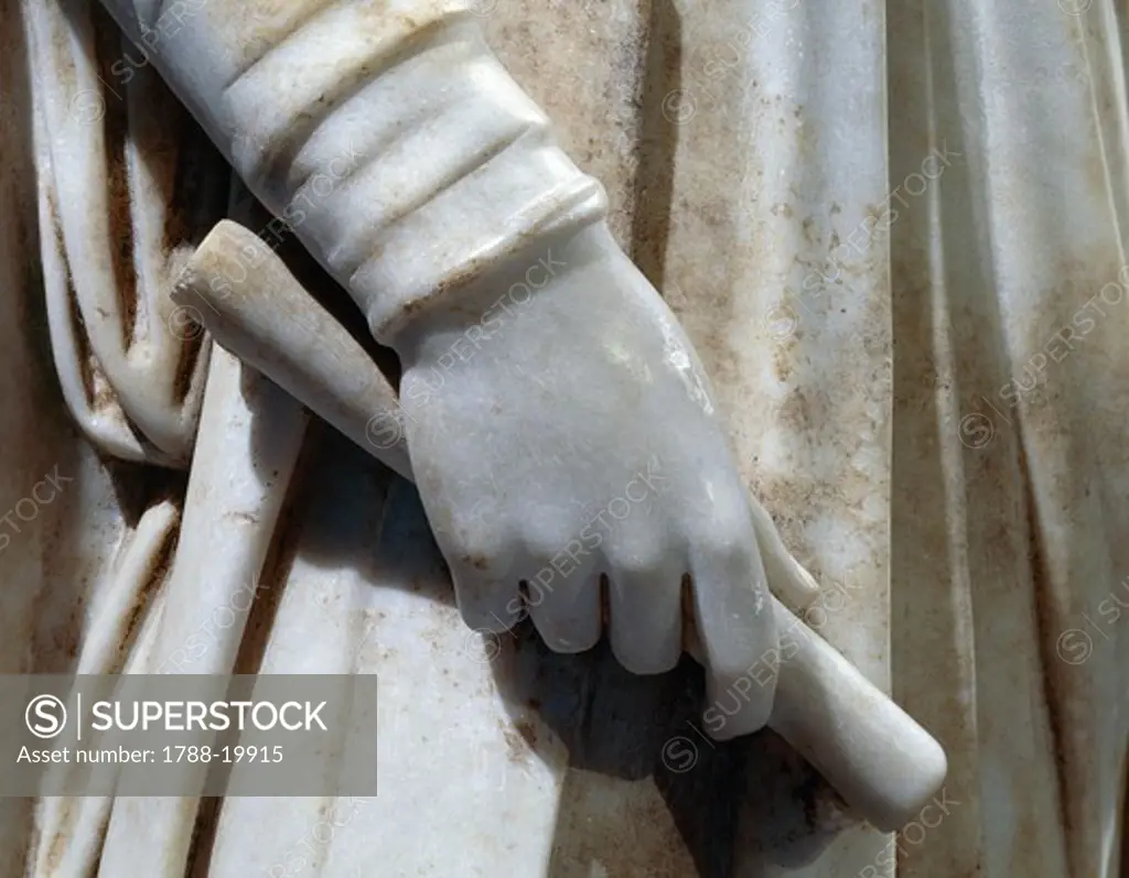 Marble statue of young man, detail of hand holding roll of parchment, 425-450 a.d.