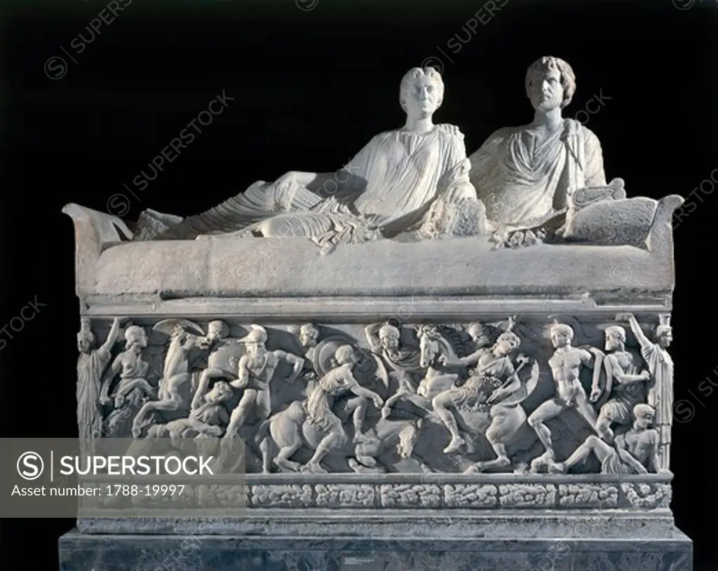 Marble sarcophagus with marble group on lid representing deceased couple and relief depicting battle between Greeks and Amazons, from Thessaloniki