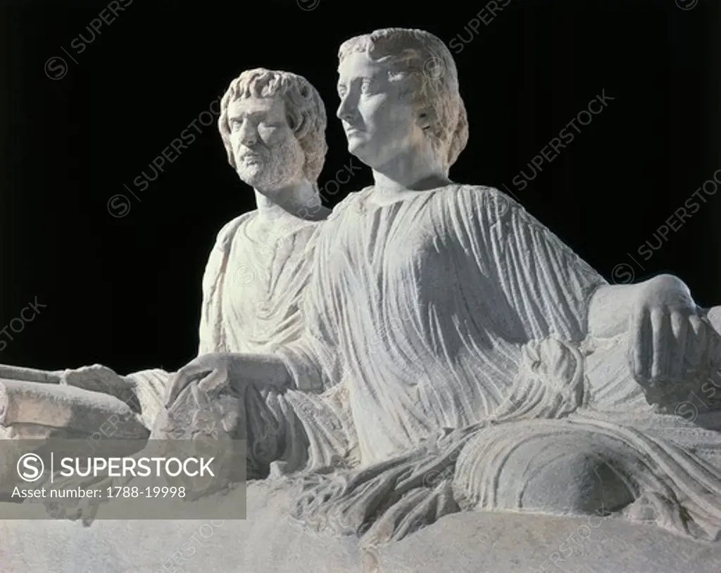 Marble sarcophagus with marble group on lid representing deceased couple and relief depicting battle between Greeks and Amazons, detail of deceased, from Thessaloniki