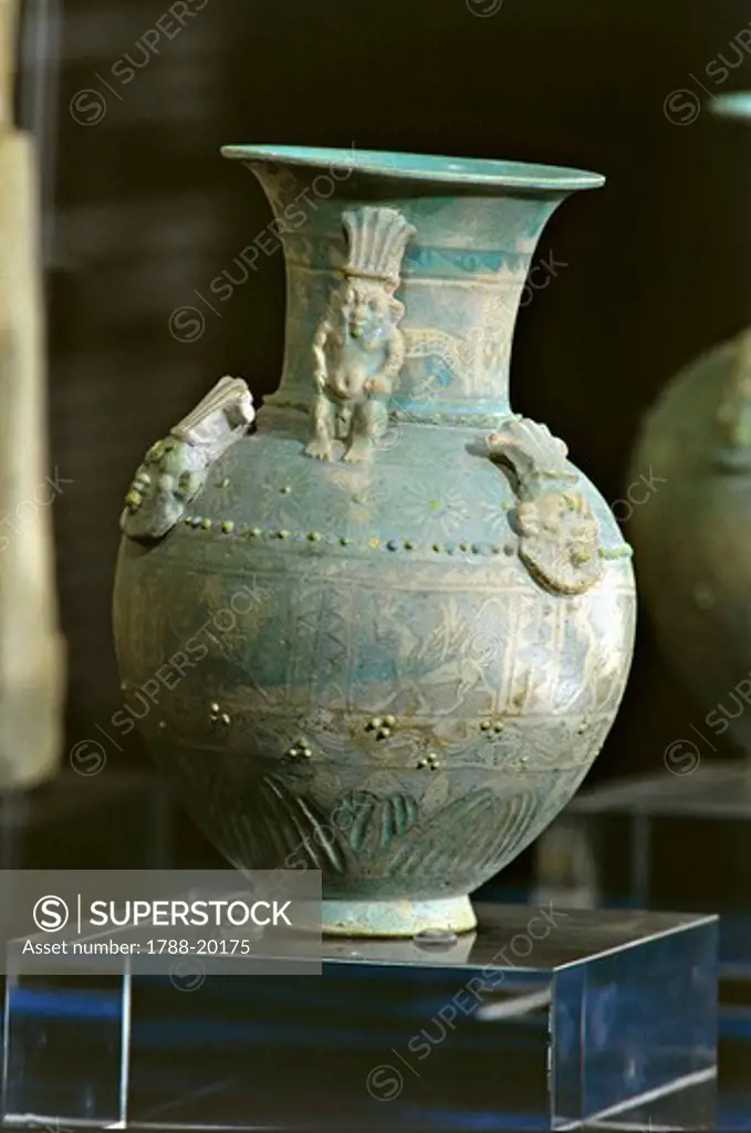 Faience vase with applied figures of the god Bes