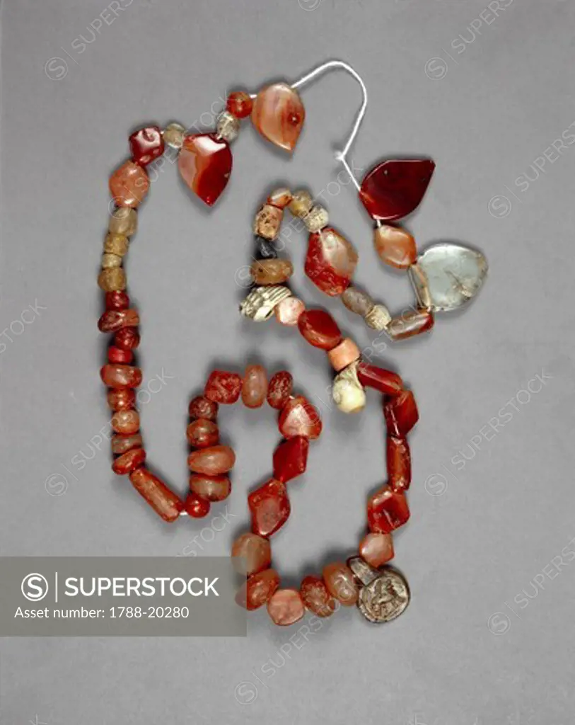 Egyptian civilization, Carnelian and shells necklace with pendant depicting a lion. From Bahariya Oasis, Valley of the Golden Mummies, 2nd century a.d.