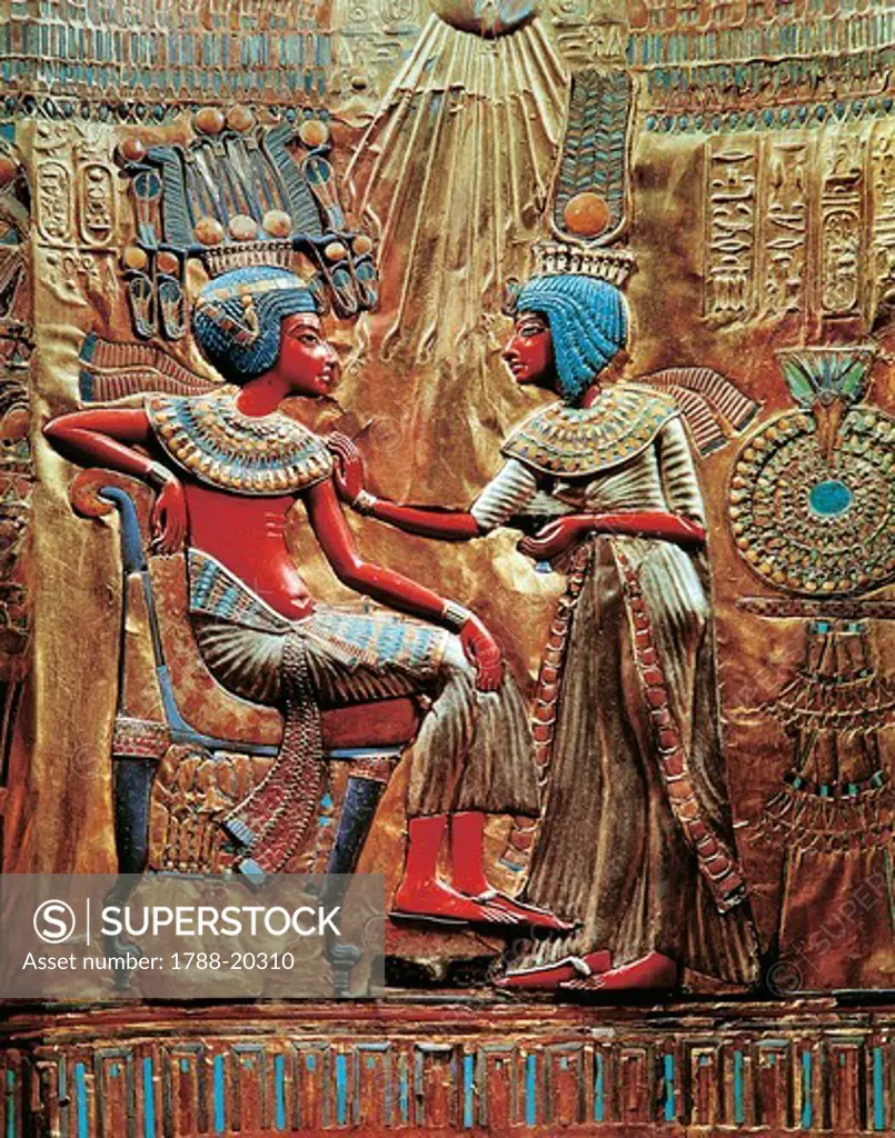 Tutankhamen and wife Ankhesenamon protected by solar disc on throne, from Treasure of Tutankhamen