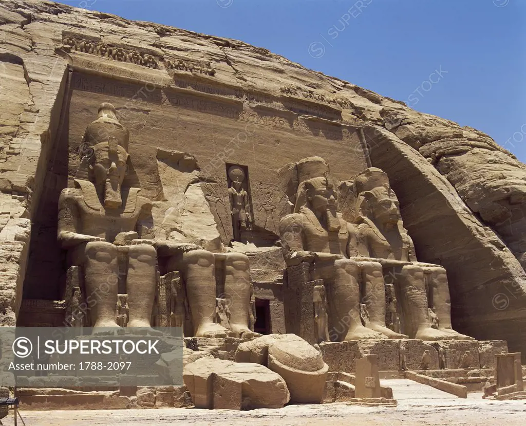 Egypt. Nubian monuments at Abu Simbel (UNESCO World Heritage List, 1979). Great Temple. Colossal four sandstone figures of enthroned Ramses II