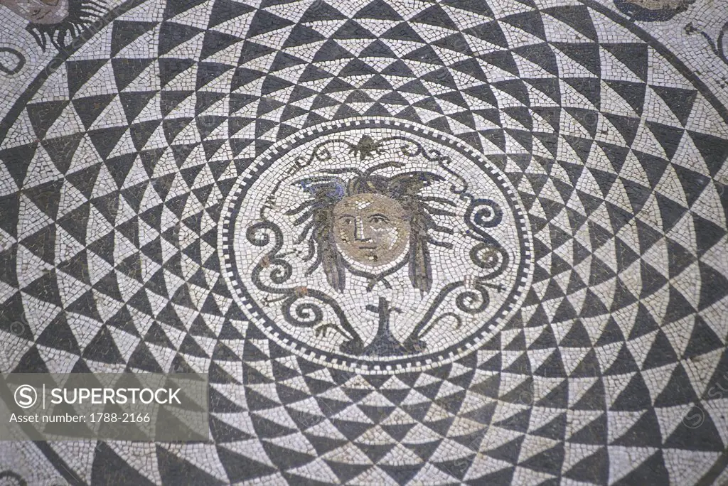 Spain - Andalusia - Carmona. Town Hall, courtyard. Roman mosaic, detail of the head of Medusa